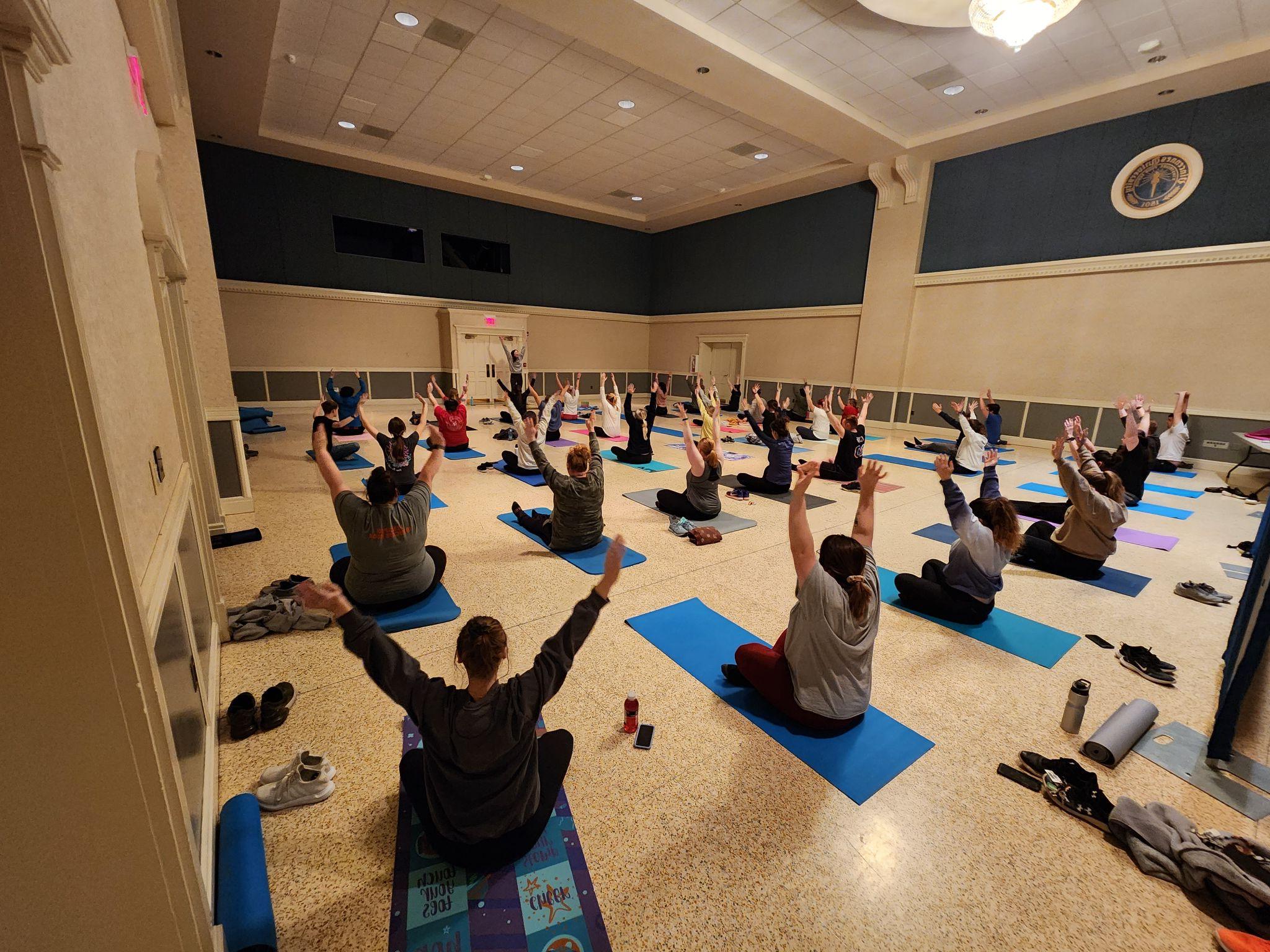 A group of students doing yoga together