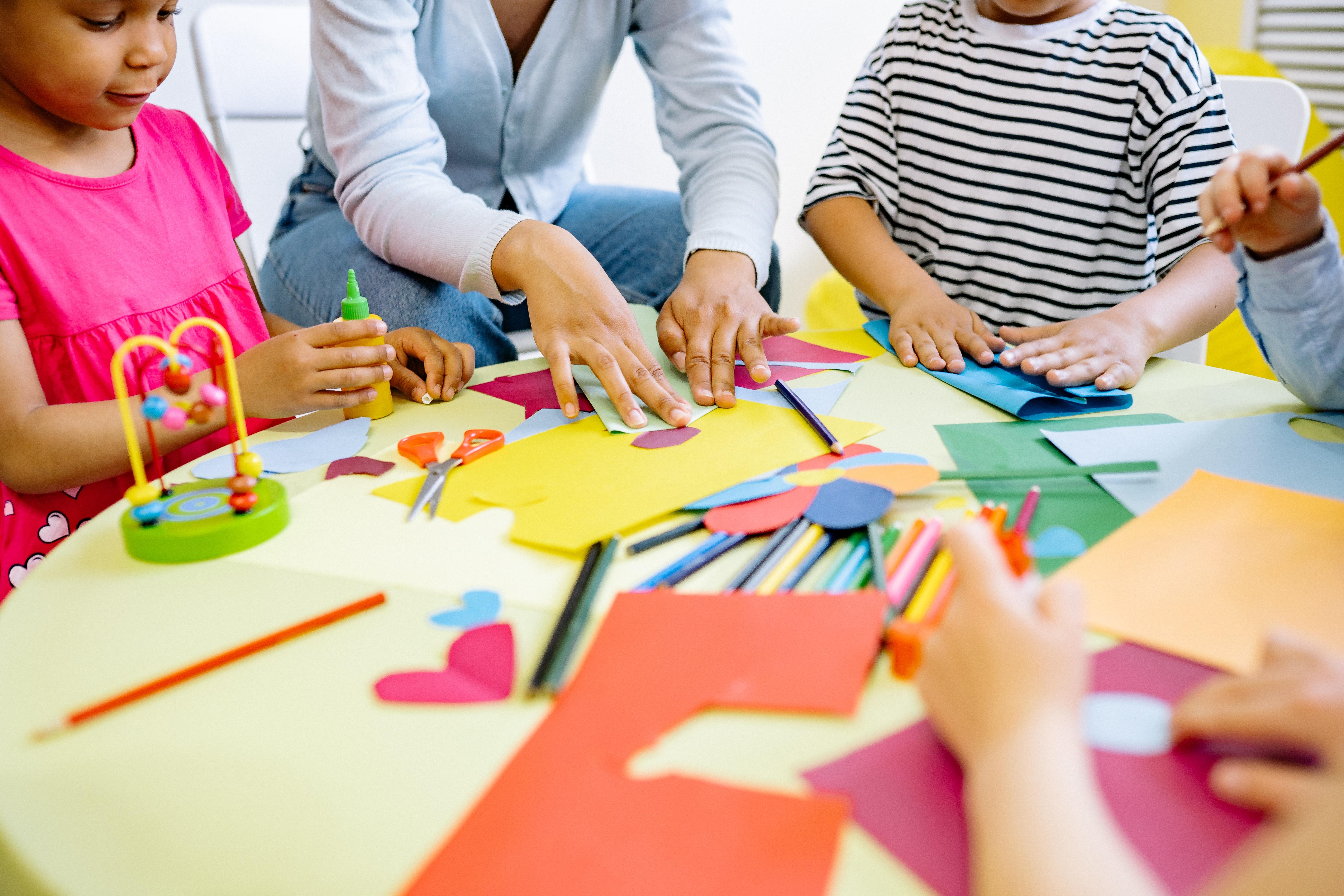 Elementary school children doing arts and crafts together