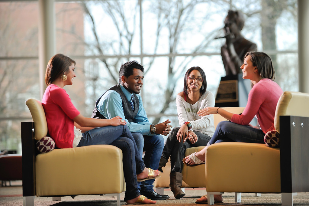 Four students sitting in Jefferson Student Union for a meeting